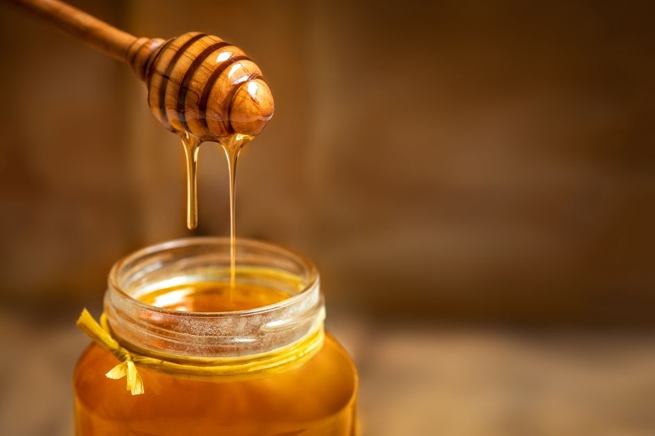 A Jar of Honey with Honey Dipper
