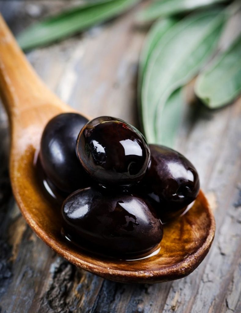 Black Olives in a Serving Spoon