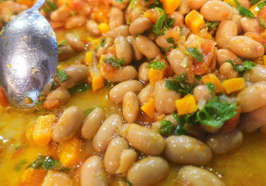 Close Up of Cooked Pinto Beans with Spoon