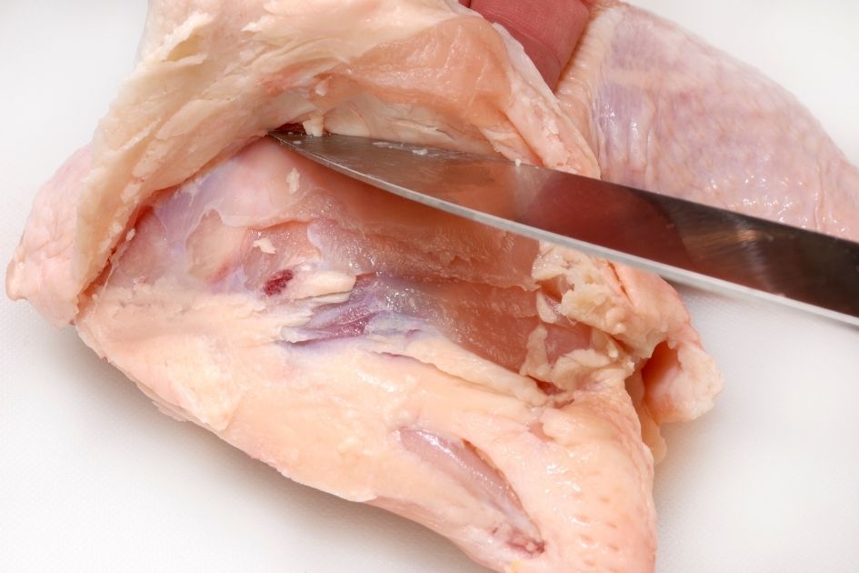 Knife Cutting out Chicken Skin with Fat