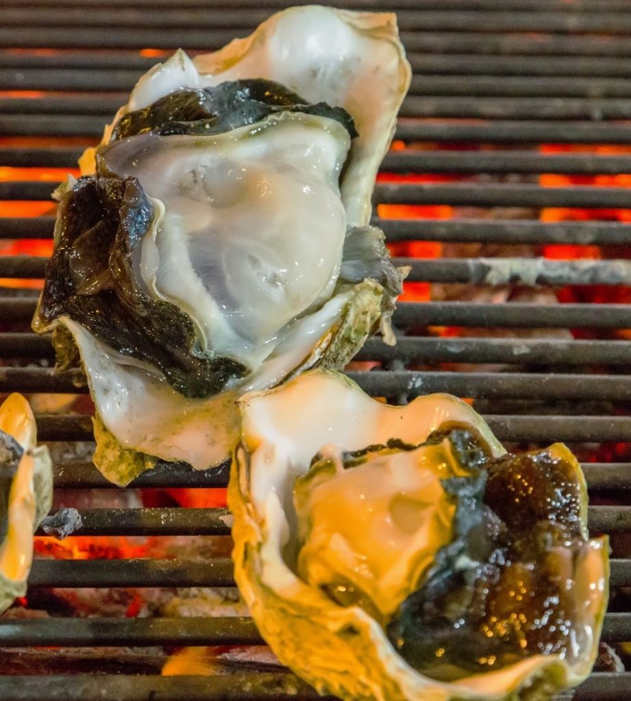 Oysters Cooking on Grill