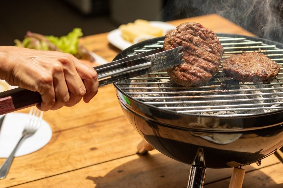 Person Holding Fork Roasting Beef