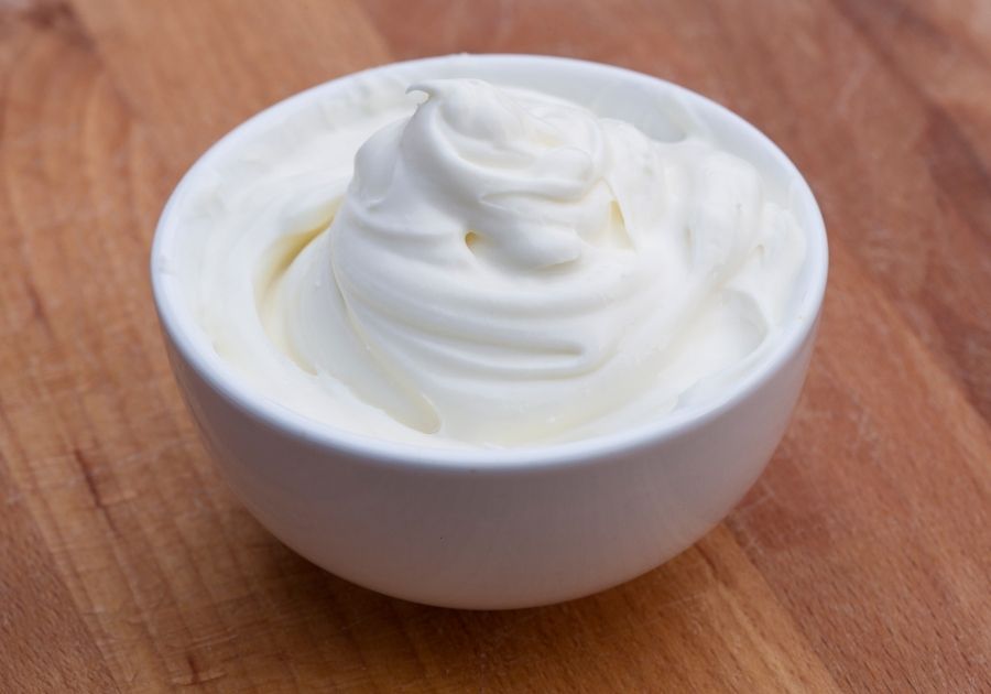 Sour Cream in White Bowl on Table